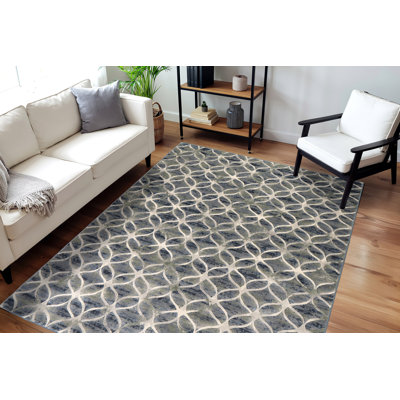 Tapis bleu à motif géométrique Majeski
