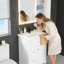 Meuble-lavabo autoportant 24 po blanc avec lavabo en céramique, tiroir ajustable et rangement fermé-1840400421