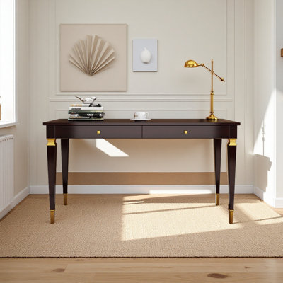 An industrial-style desk with copper handles