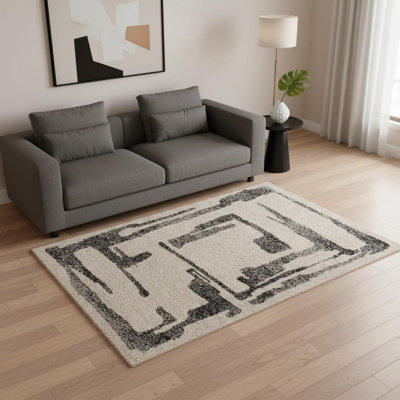 Tapis abstrait beige et noir 5 pi x 8 pi