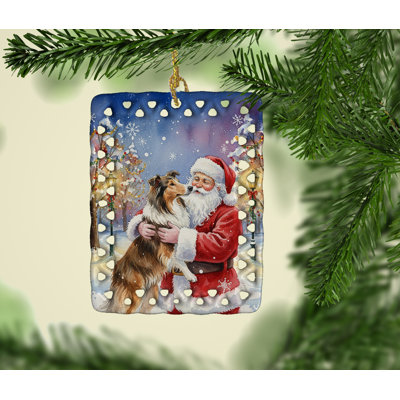 Collie avec ornement en porcelaine Père Noël