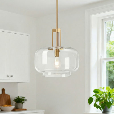 Suspension simple en laiton brossé, verre transparent, abat-jour en forme de dôme transparent et tige de suspension réglable.