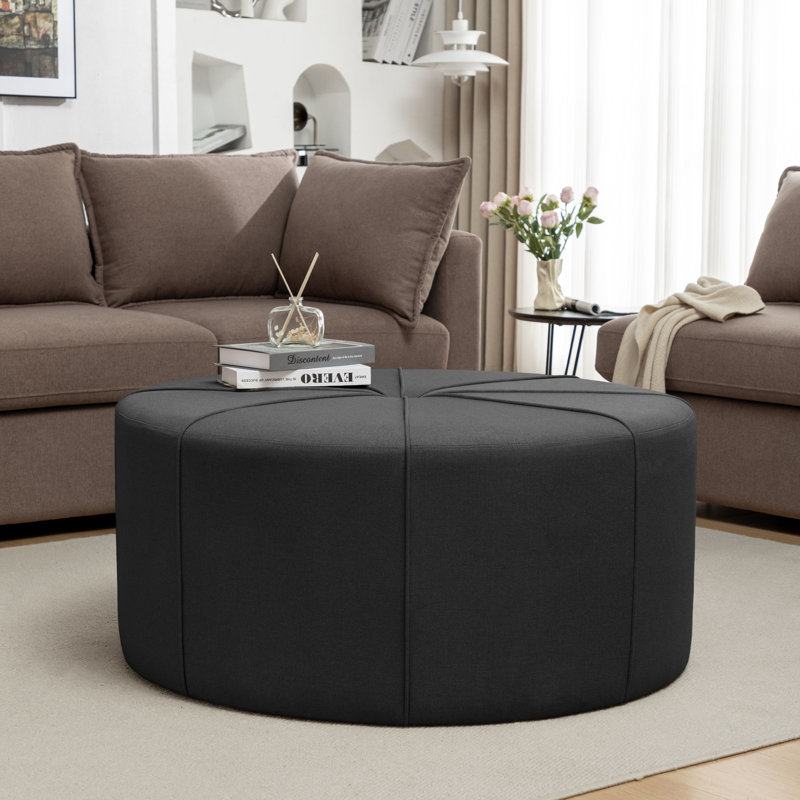 Wrought Studio™ Aron 39.4" Fabric Round Cocktail Ottoman, Brackman Dark Gray Fabric