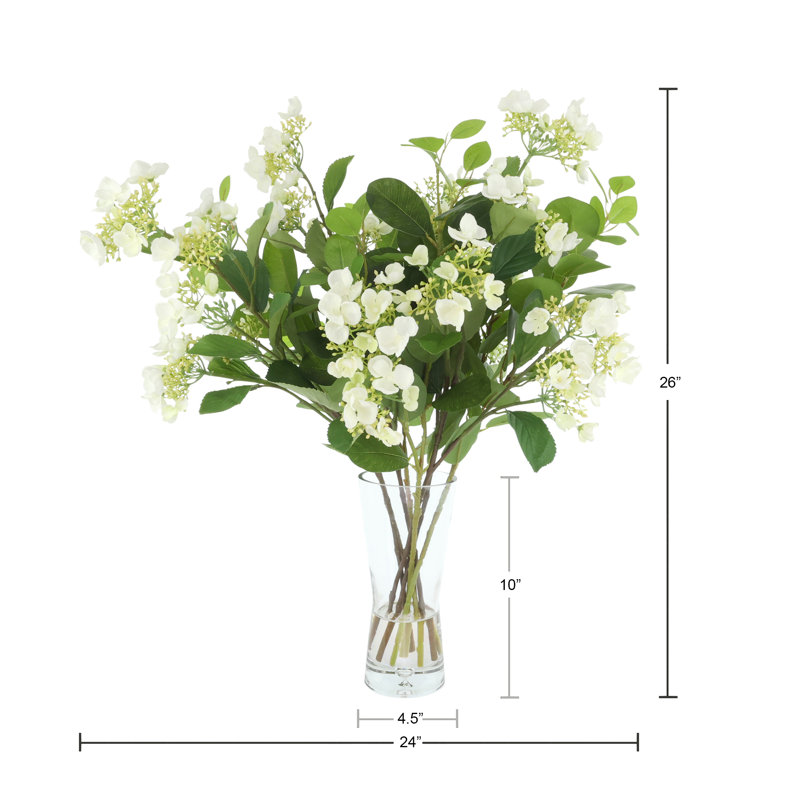 Viburnum Floral Arrangement In A Bubble Glass Vase With Fiscus Leaves