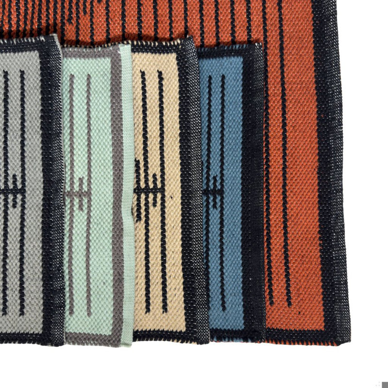 Tapis d'intérieur / extérieur à motif géométrique minimaliste orange et noir tissé à la main Ferdinand Authentic