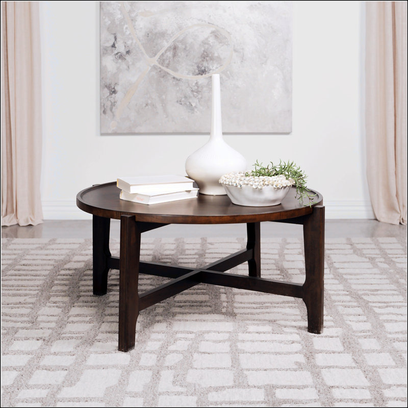 Table basse ronde en bois massif brun foncé