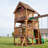 Backyard Discovery Highlander Cedar Wood Swing Set with Wave Slide, Three-Story Clubhouse, Rock Wall, and Picnic Table