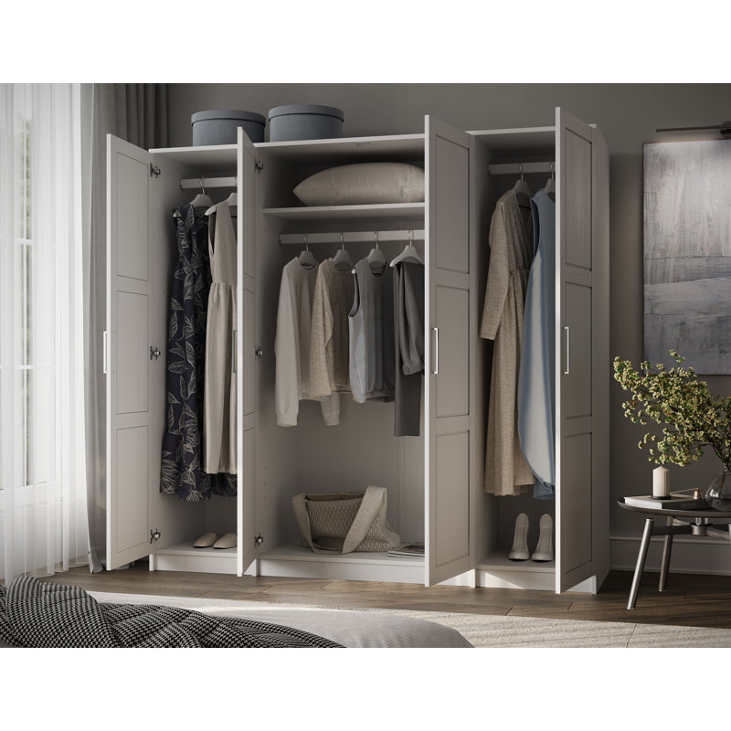 Armoire-penderie 100% en bois massif à 4 portes avec tige suspendue et tablettes.