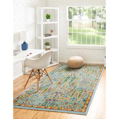 Tapis rond en polypropylène tissé à la machine à motif floral turquoise / bleu / orange