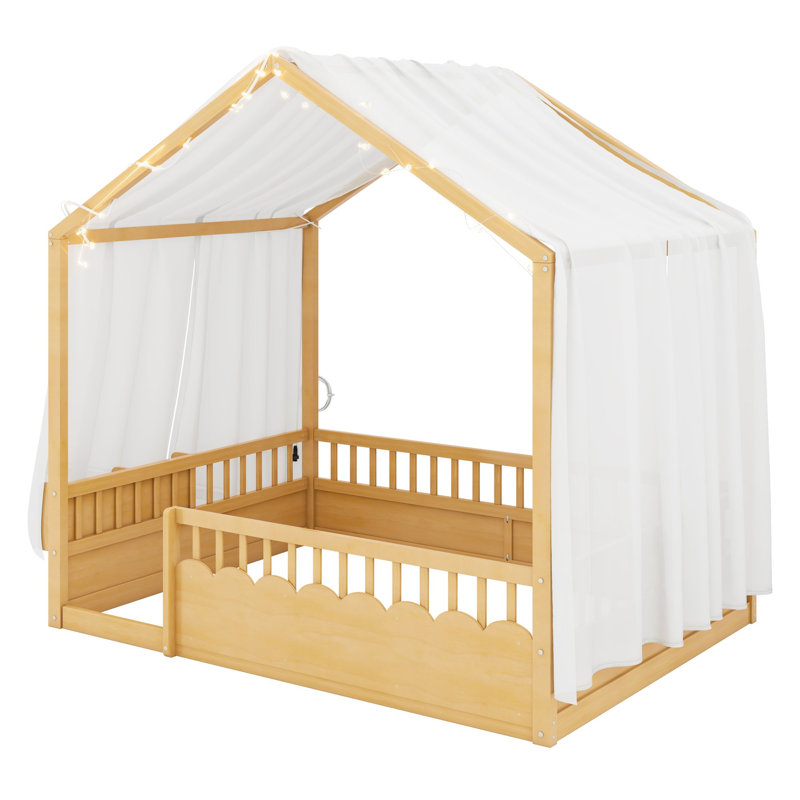 Lit Montessori au sol avec baldaquin, barrières de sécurité et porte pour des chambres d'enfants confortables et ludiques