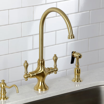 Kingston Brass Vintage Two-Handle 2-Hole Deck Mount Kitchen Faucet with Brass Sprayer