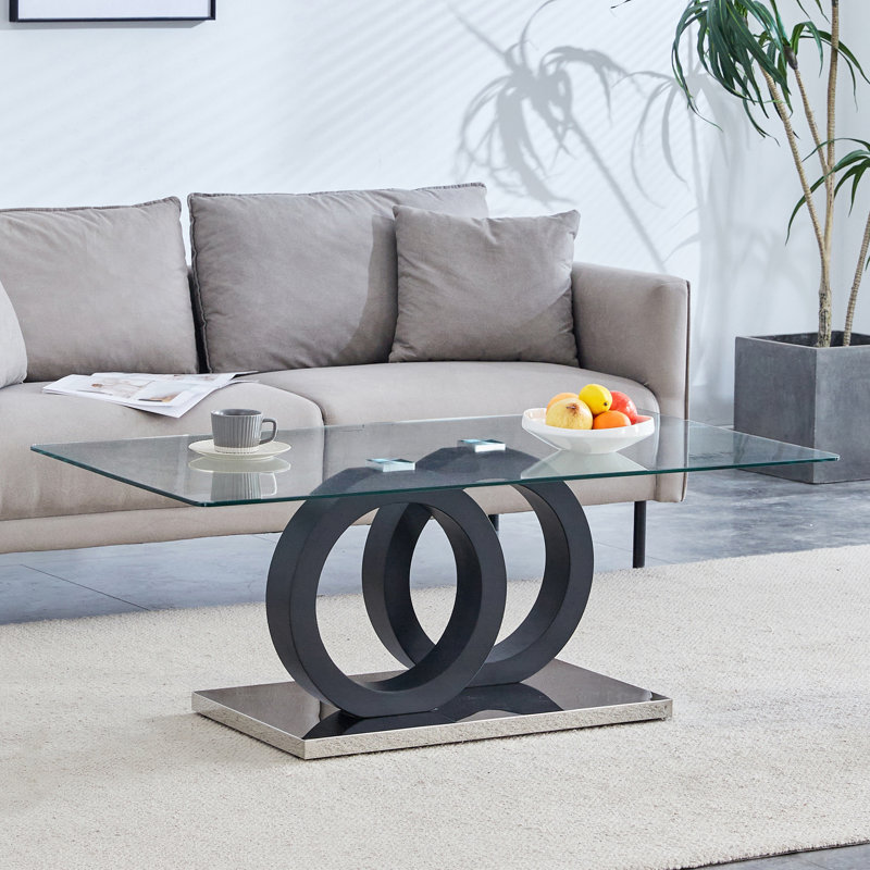 Table basse de style moderne avec plateau en verre