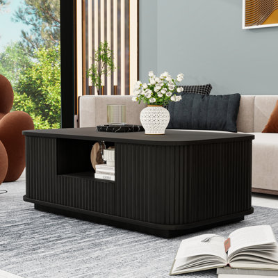 Table basse contemporaine à panneau incurvé ondulé avec tiroirs de rangement et compartiments cachés
