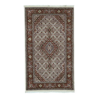 Tapis crème et rouille noué à la main de haute qualité