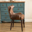 Fauteuil demi-tonneau capitonné à dossier capitonné