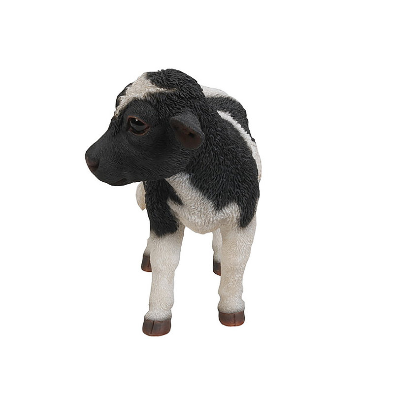 Statue de vache debout noir et blanc