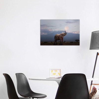 Elephant Holding Up Moon In Africa by Susan Schmitz - Wrapped Canvas Print