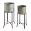 Round Corrugated Metal Planters on Stands-392773944