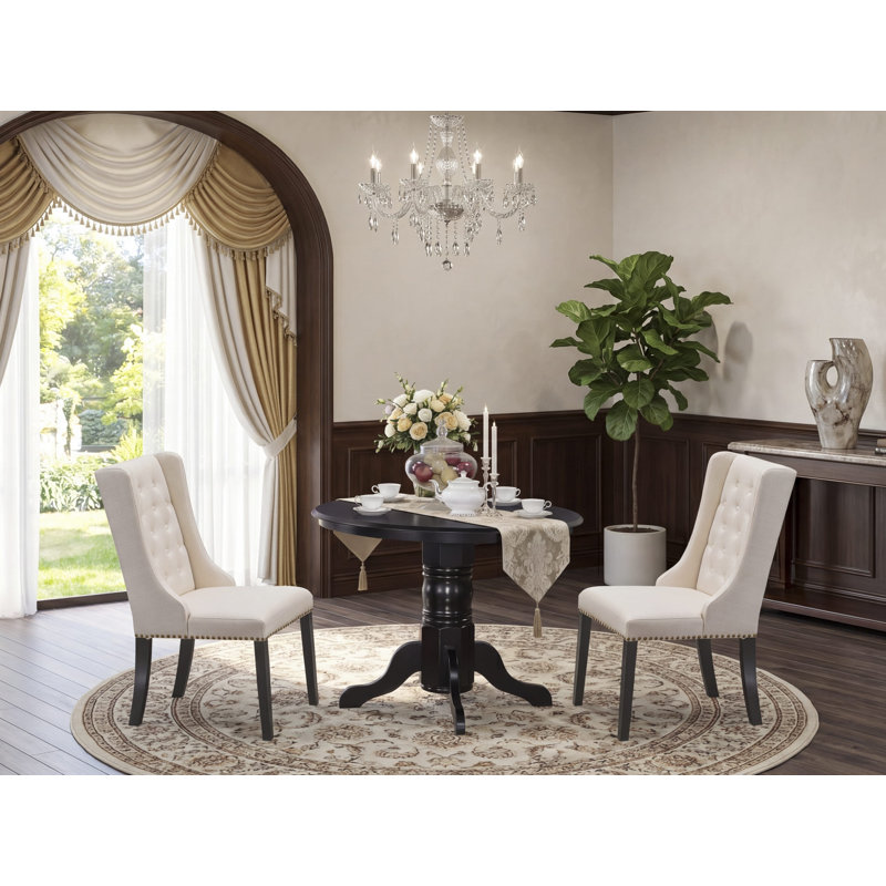 Ensemble de coin-repas 3 pièces pour petits espaces comprenant une table de cuisine ronde avec piédestal et 2 chaises de salle à manger Parson en tissu crème, noir