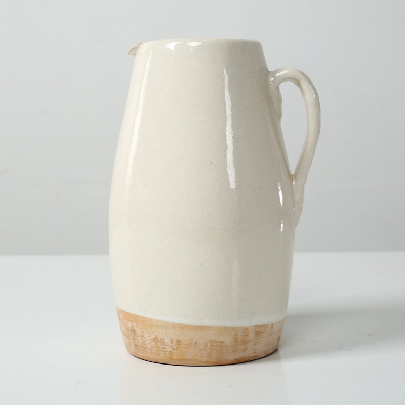 Approx. 9" High Off Whtie Ceramic Pitcher