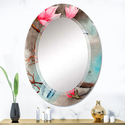 Un corbeau sur les branches de magnolia avec des fleurs - miroir mural traditionnel ovale