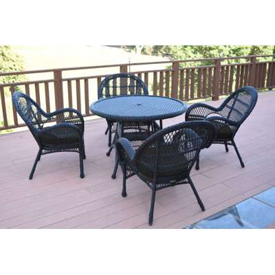 Mangum 4 - Person Wicker Patio Dining Set with Round Table