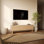 Meuble TV Ã  3 portes, faÃ§ade sculptÃ©e de motifs gÃ©omÃ©triques, finition bois clair