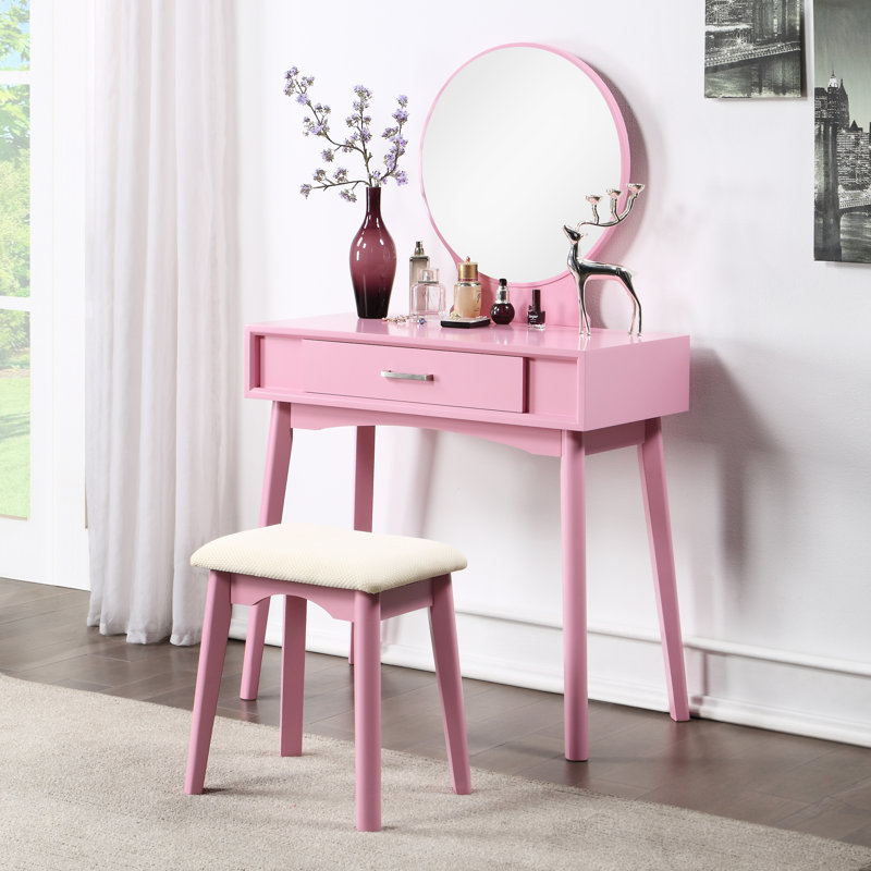 Coiffeuse et tabouret en bois rose avec rangement fonctionnel. Style chic, matériaux contemporains et design tendance.
