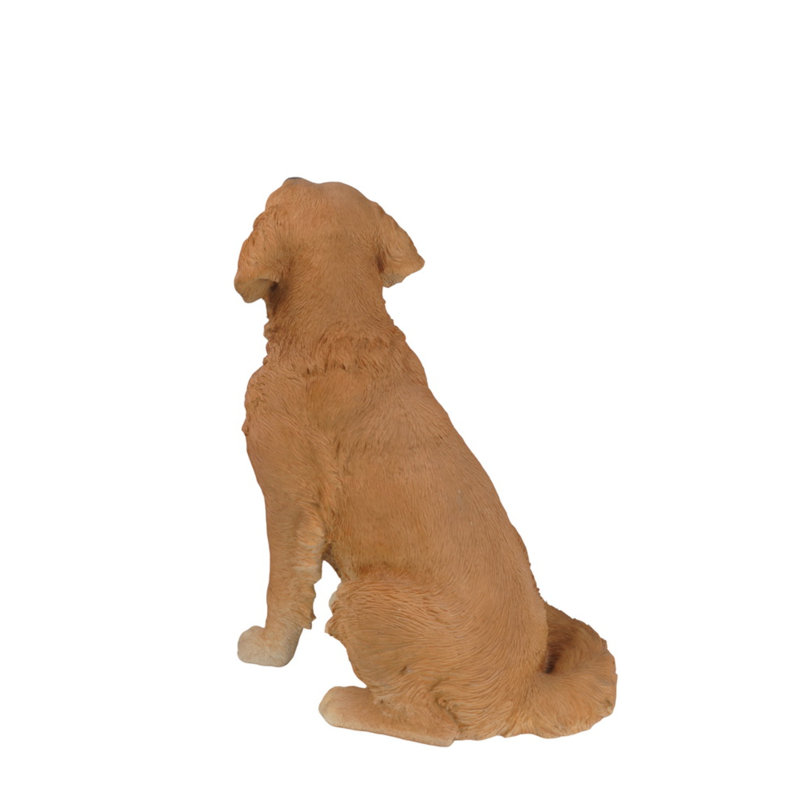 Statue golden retriever assis
