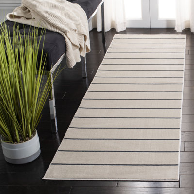 Aslin Striped Ivory / Navy Area Rug