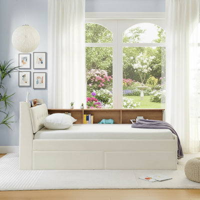 Ce canapé-lit double en velours beige dispose d'une tête de lit avec rangement, de deux tiroirs de rangement, d'une charge sans fil et d'un éclairage à DEL, combinant de multiples fonctions avec une sensation sophistiquée.