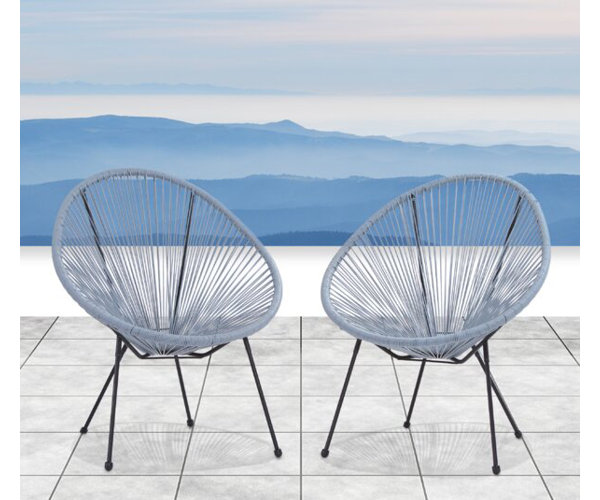 Carlita papasan set of two patio chairs on mountain-side patio.