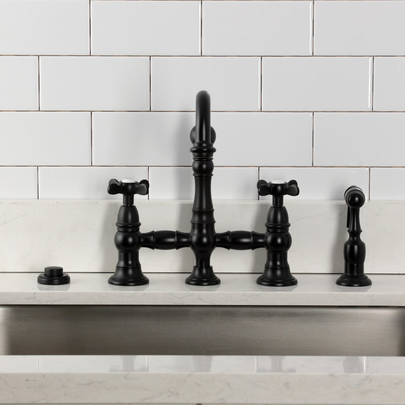 Kingston Brass Essex Two-Handle 4-Hole Deck Mount Bridge Kitchen Faucet With Brass Side Sprayer, Matte Black