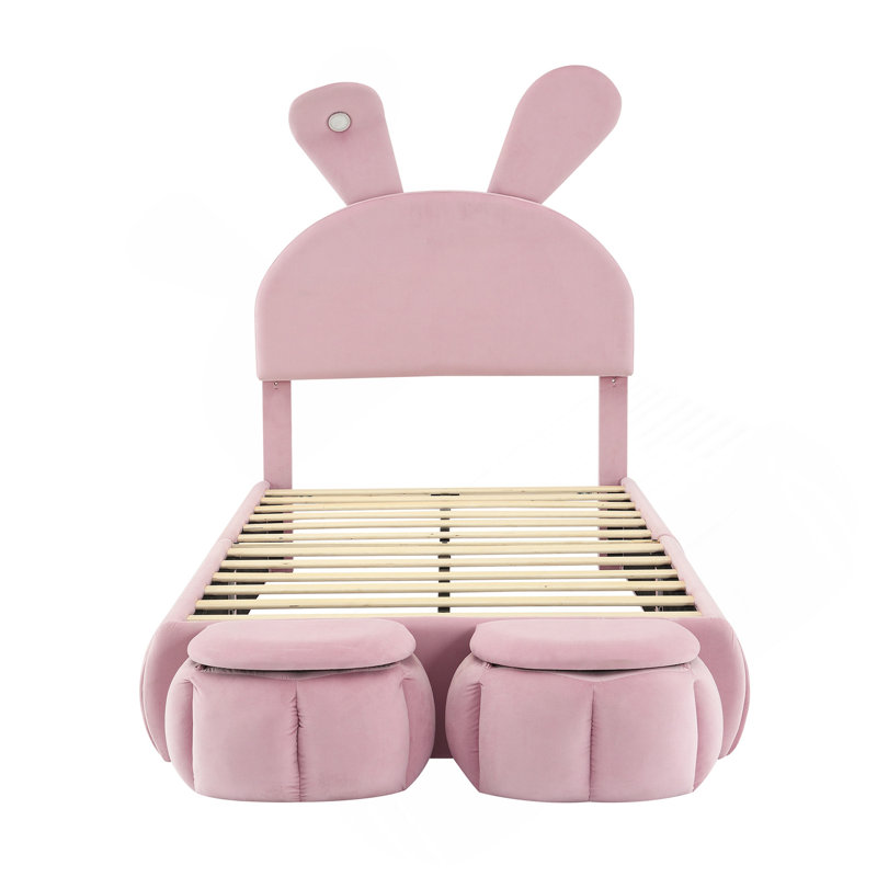 Lit plateforme simple tapissier avec oreilles dessinées et tête de lit rose clair