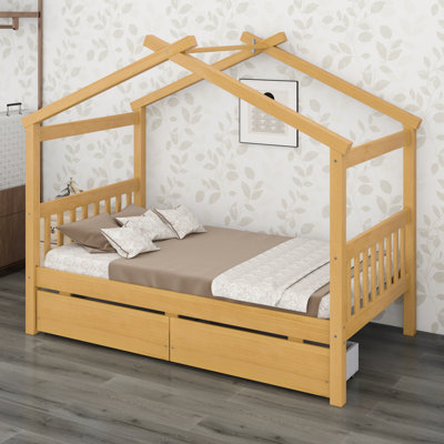 Lit en bois de style maison avec tiroirs, combinant jeu et organisation