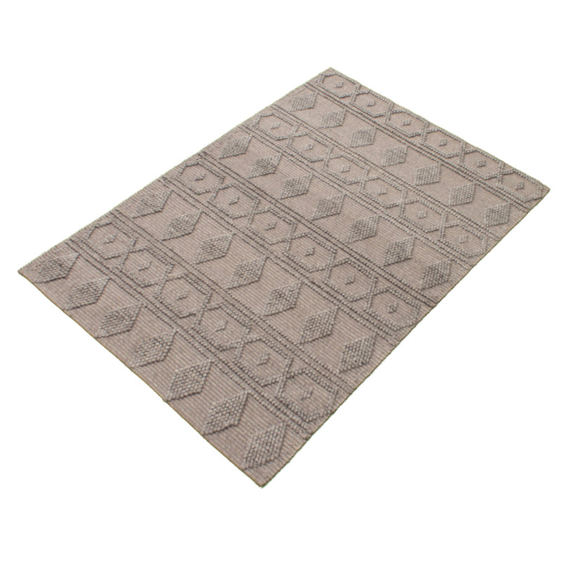 Tapis gris géométrique en laine tressé à la main