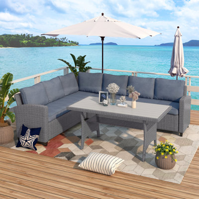 Cahan 7 - Person Patio Dining Set with Rectangular Table , Cushions Included