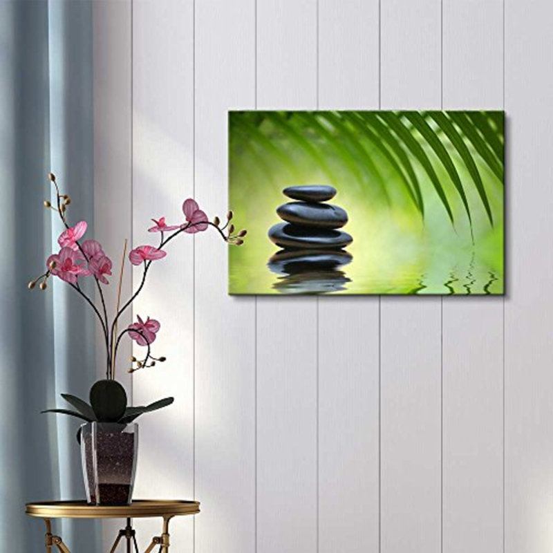 «Green Bamboo Leaves over Zen Stones Pyramid Reflecting in Water Surface», reproduction de photo sur toile tendue