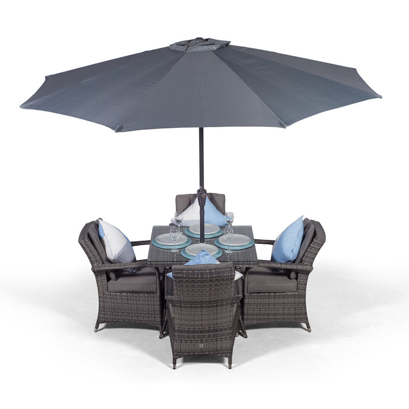 Karas 4 - Person Wicker Patio Dining Set with Square Table , Cushions Included