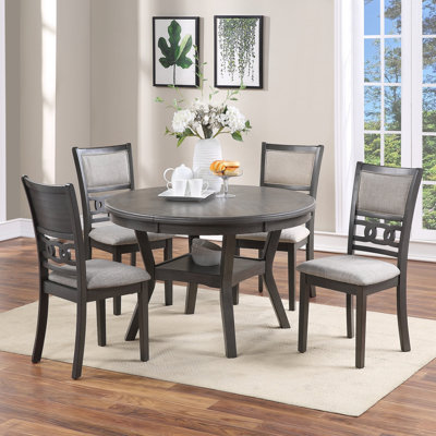 Ensemble de salle à manger contemporain avec table ronde et quatre chaises d'appoint, alliant élégance et confort