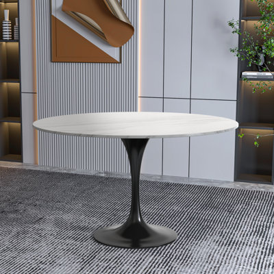 Table de salle à manger ronde avec plateau en résine et base en acier inoxydable noir Heatherton