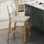 Tabouret de bar en similicuir tissé avec dossier et pieds en bois massif