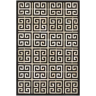 https://assets.wfcdn.com/im/75038675/resize-h310-w310%5Ecompr-r85/7936/79367356/chalet-cowhide-geometric-area-rug-in-black.jpg