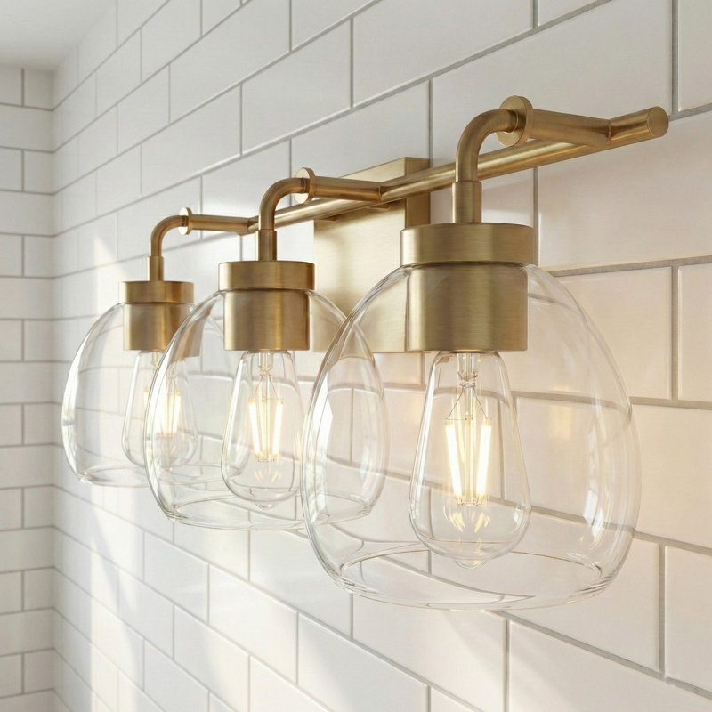 Meuble-lavabo 3 lumières 24 po avec globes en verre transparent Brandon, Laiton