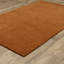 Tapis en laine rouille unie Makhari-1003433167