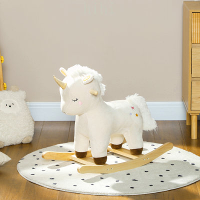Cheval à bascule magique licorne en peluche avec sons réalistes, base en bois pour un jeu sécuritaire et confortable, idéal pour les enfants de 2 à 4 ans.