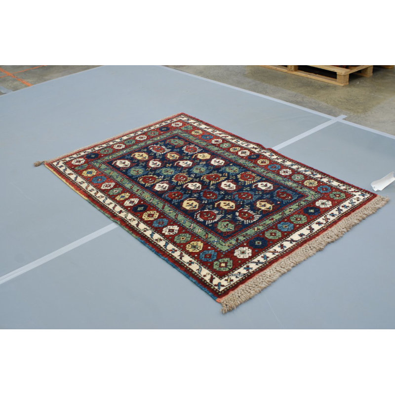 Seychour Wool Oriental Area Rug in Green/Red