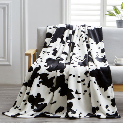 Jeté décoratif à imprimé vache