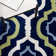 Tapis vert / bleu / beige en laine touffeté à motif géométrique Carolene