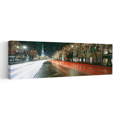 Blurred Motion Of Cars Along Michigan Avenue Illuminated With Christmas Lights Chicago Illinois USA by Vito Palmisano - Wrapped Canvas Panoramic Print